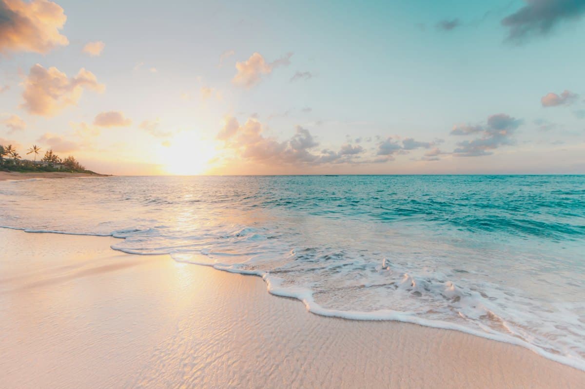 Sunset over a calm sea beach