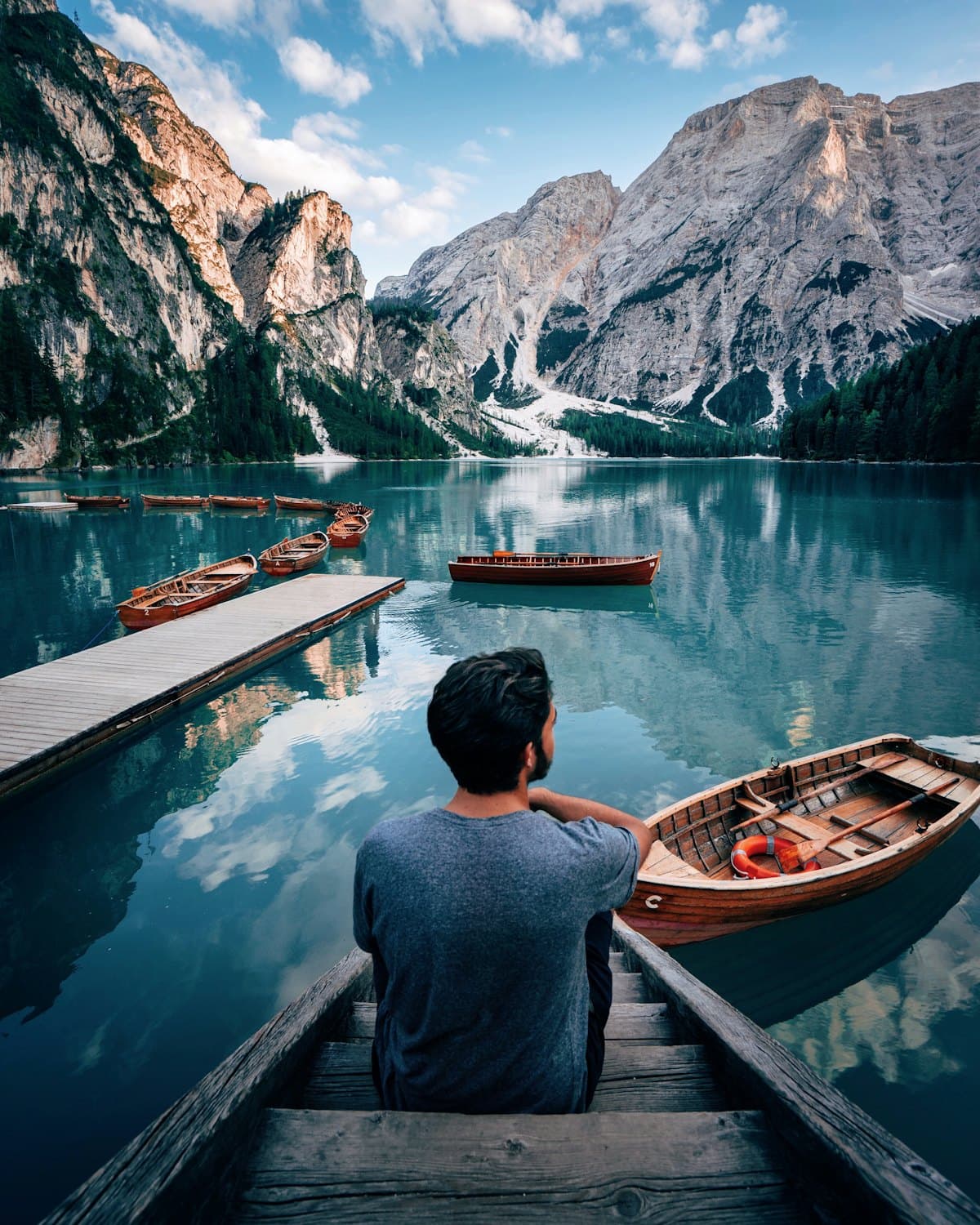 Wooden boats on a calm mountain lake